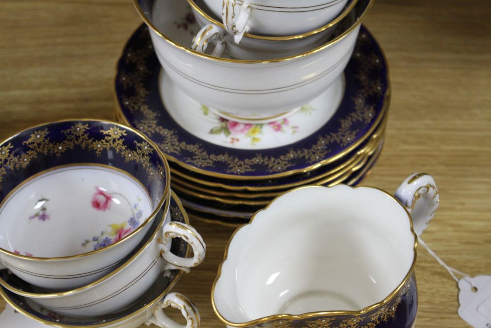 A Royal Worcester part tea service, painted with flower sprays by Ernest Phillips and Ernest Barker,